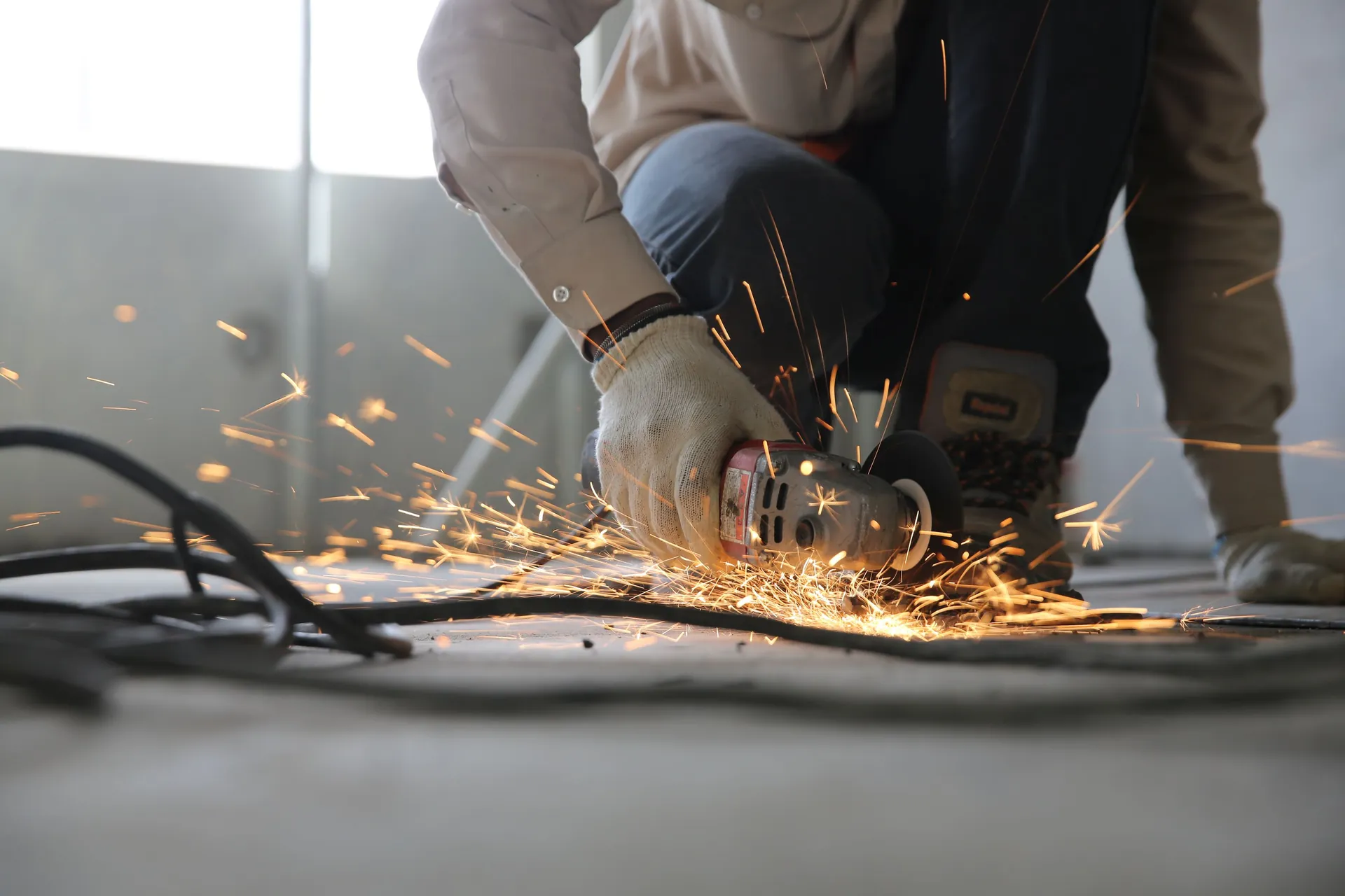 Contractor cutting steel on an active construction site
